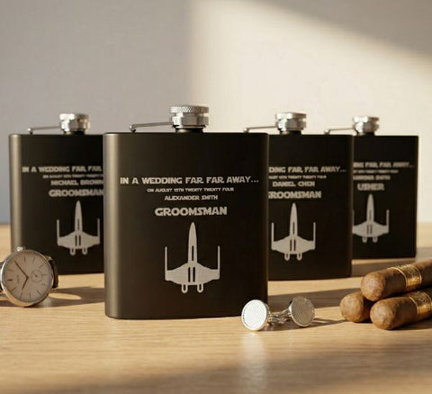 Nerdy groomsmen gifts led by a personalized Star Wars inspired flask set engraved with each groomsman's name in movie style lettering