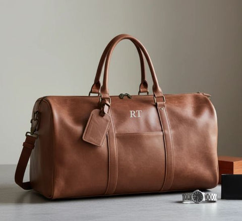 Personalized leather weekender duffle monogrammed with initials, one of 20 leather groomsmen gifts curated by Groovy Groomsmen for 2026.