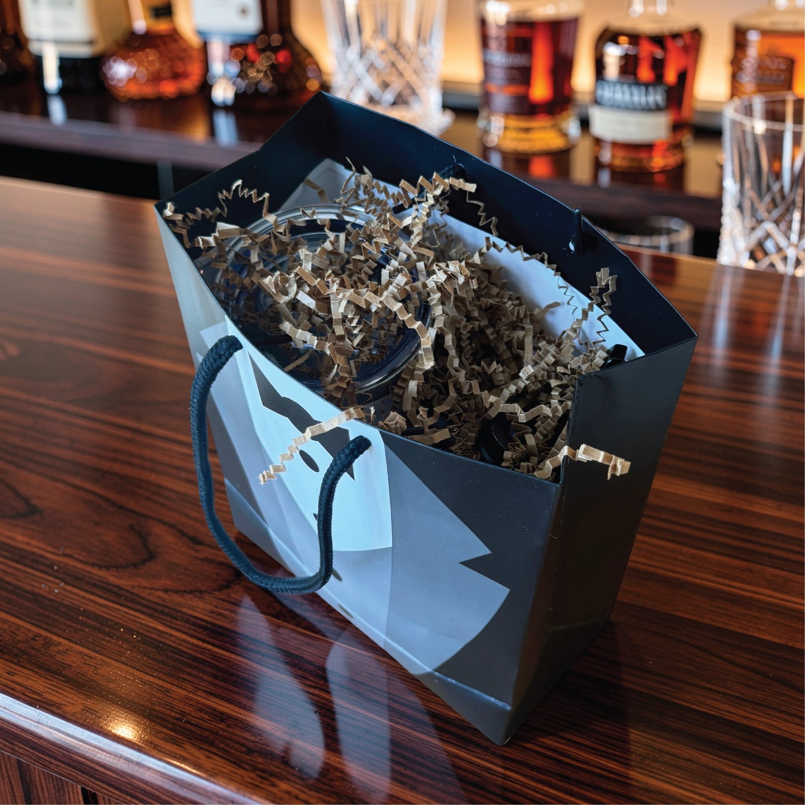 Open tuxedo groomsmen gift bag filled with paper shred, the way the groomsmen gift set arrives ready to give