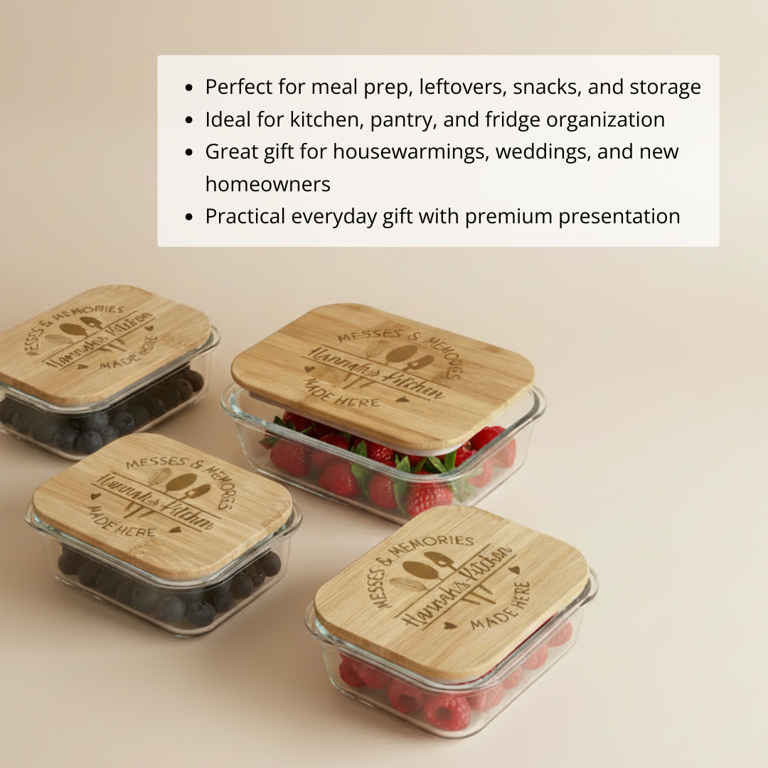 Four glass food storage containers with wooden lids engraved with sample text "Messes & Memories," "Homemade with Love Here," and utensil motifs, containing berries and other foods.