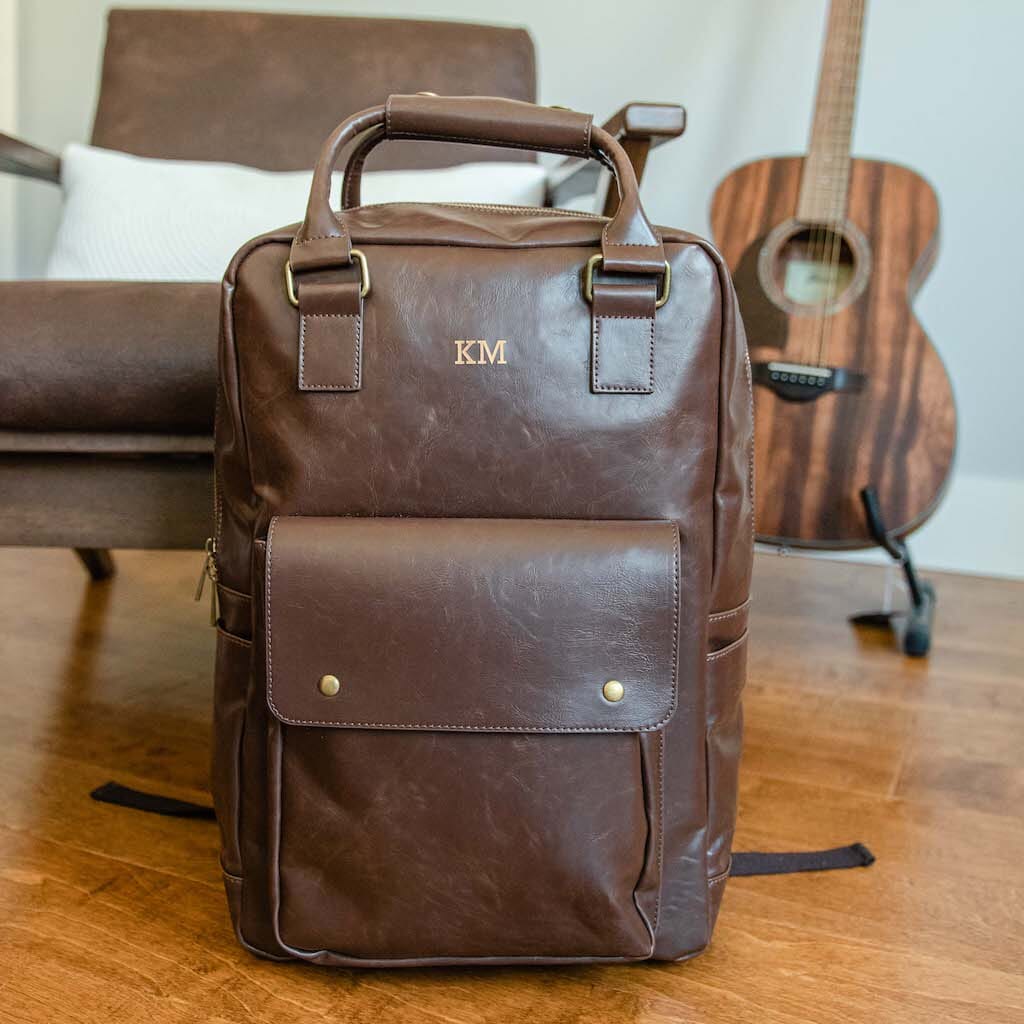 Brown vegan leather laptop backpack with custom name engraving and front flap pocket