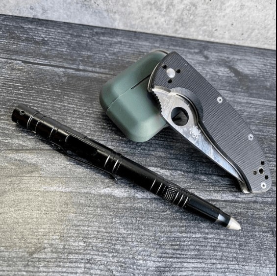 Engraved black multitool tactical pen with LED flashlight and survival tools