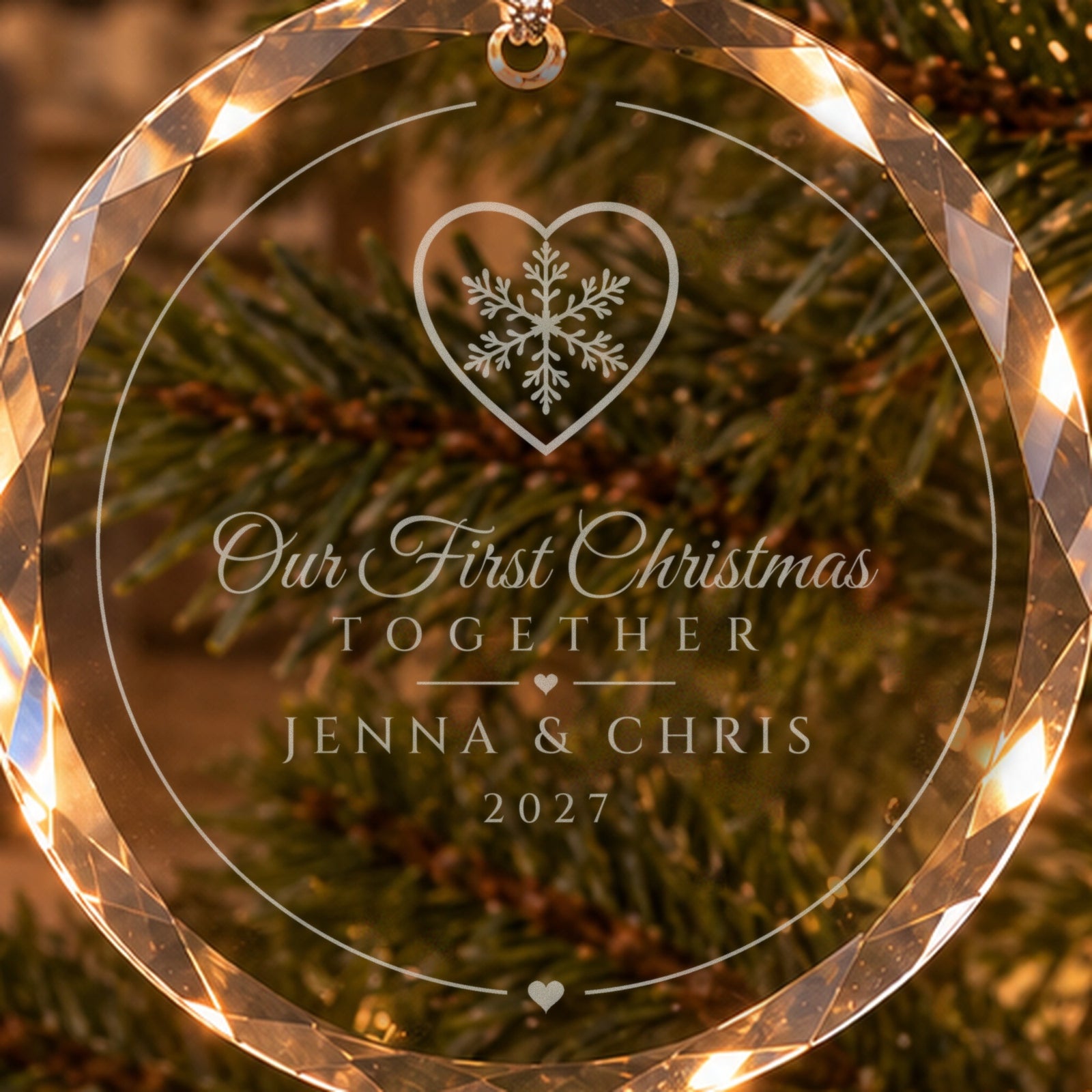 Close-up of the frosted engraving: a snowflake inside a heart, Our First Christmas Together, JENNA & CHRIS, 2027