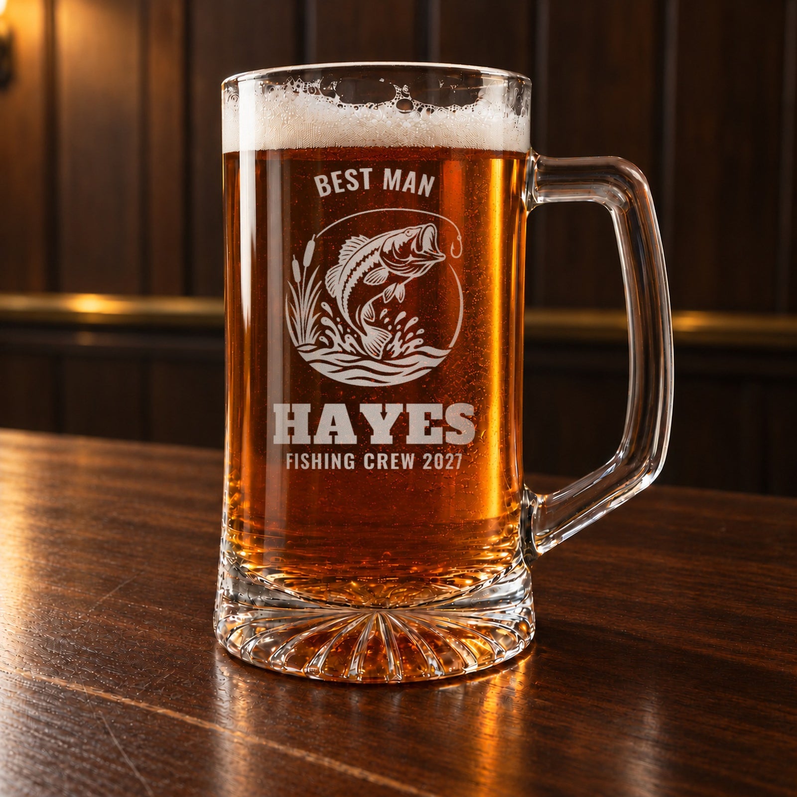 Personalized fishing beer stein on a walnut bar, engraved with a leaping largemouth bass: Best Man, Hayes, Fishing Crew 2027