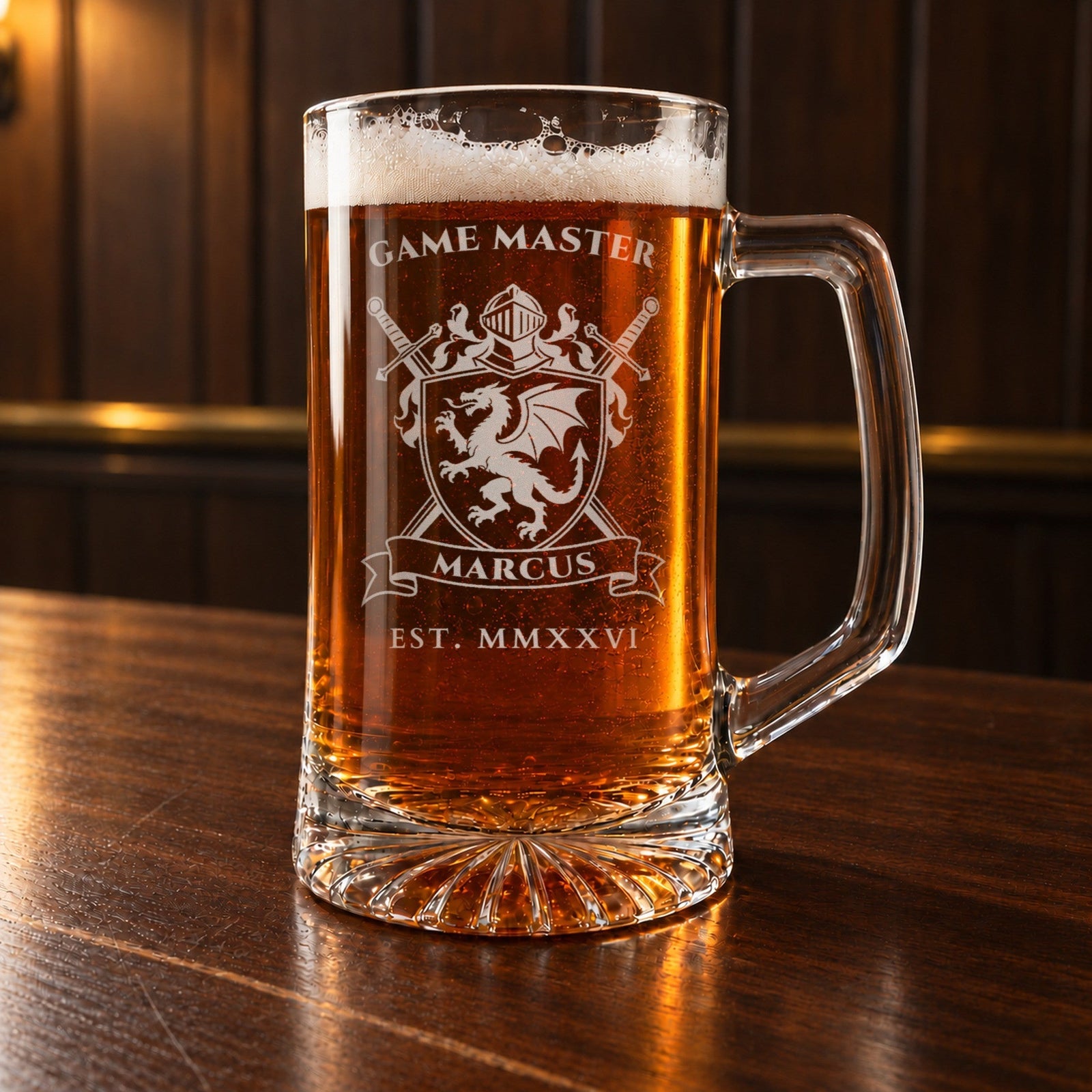 Geeky groomsmen gift: a personalized 25 oz glass beer mug on a walnut bar top, laser engraved with a dragon crest, GAME MASTER over the shield and MARCUS on the banner
