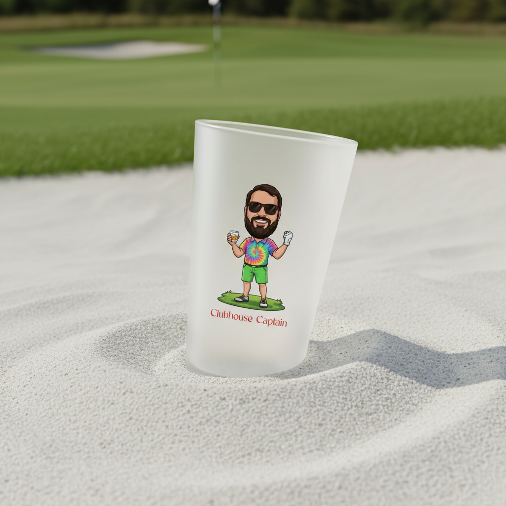 Frosted glass koozie displayed in sand on golf course, featuring custom cartoon illustration of man in tie-dye shirt and sunglasses labeled "Clubhouse Captain