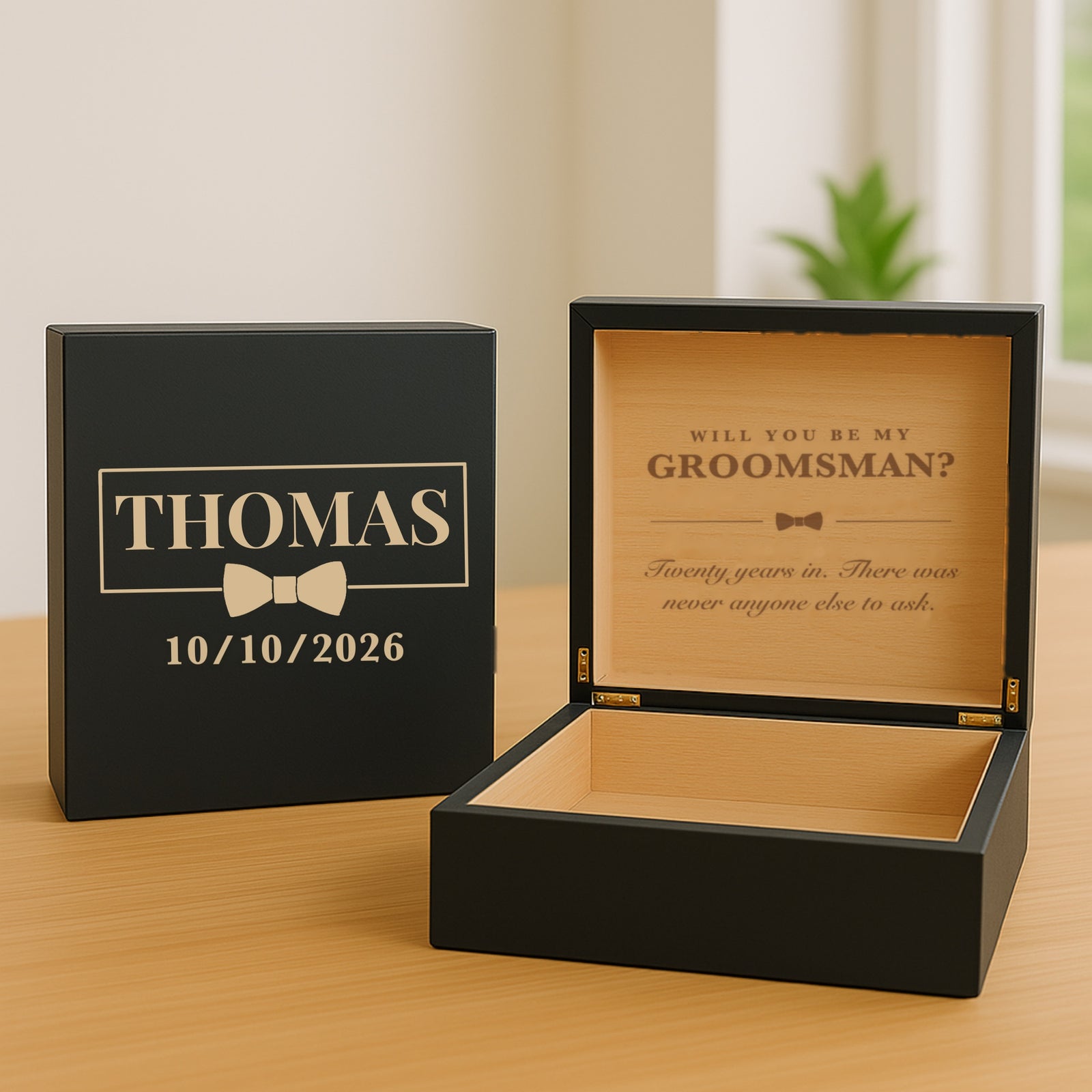 Black personalized keepsake box for a groomsmen proposal, name and wedding date on the lid and the engraved question showing inside.