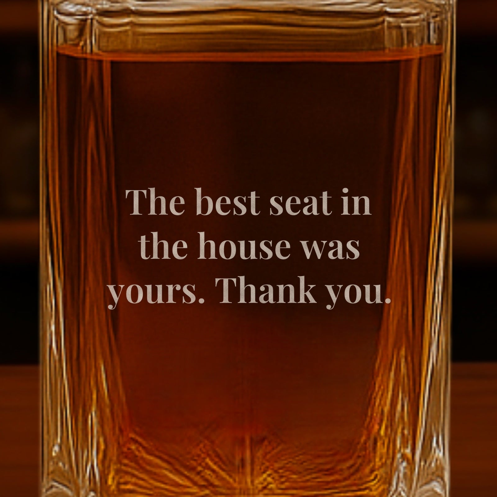 Close-up of a thank-you note engraved on the back of a wedding officiant gift decanter: The best seat in the house was yours. Thank you.