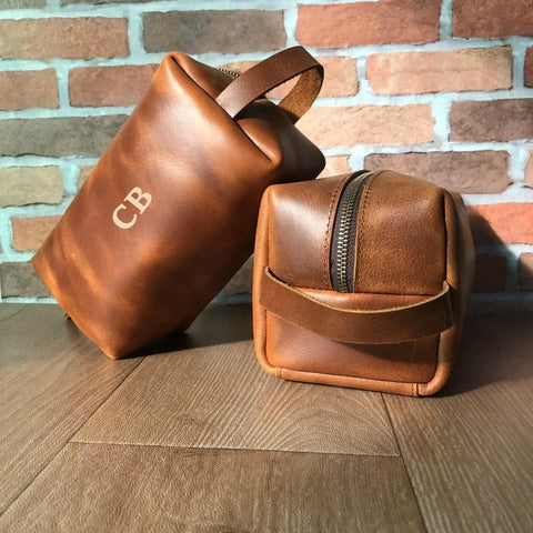 Monogrammed leather dopp kit engraved with his initials, a premium best man gift he uses on every trip after the wedding.