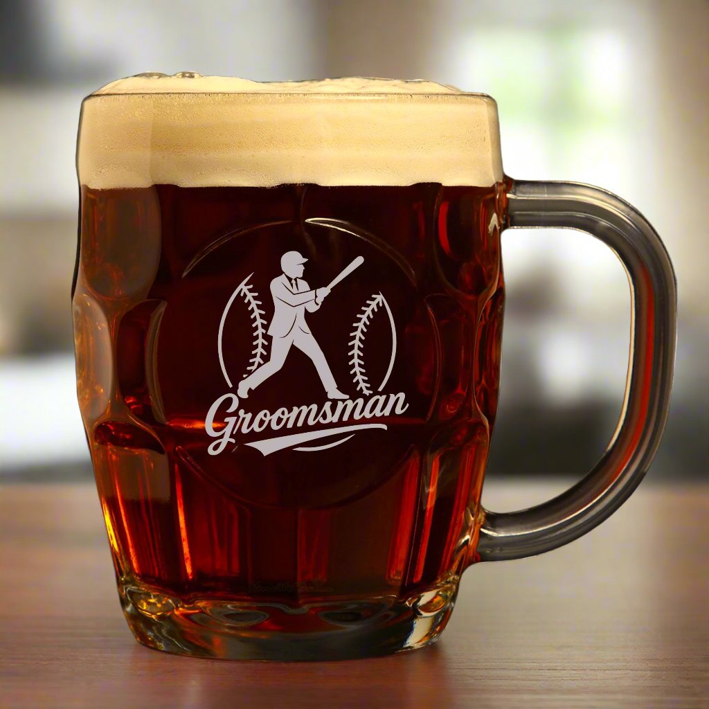 Glass mug with &#39;Groomsman&#39; engraving filled with beer on a white background