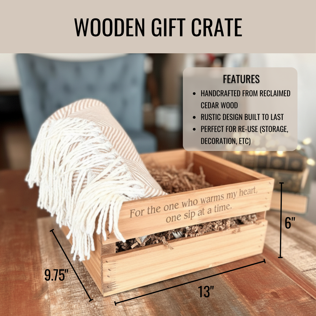 Light wood crate with engraved sample text "For the one who warms my heart, one sip at a time" and white fringe blanket draped over edge, measuring 13" wide by 9.75" deep by 6" tall