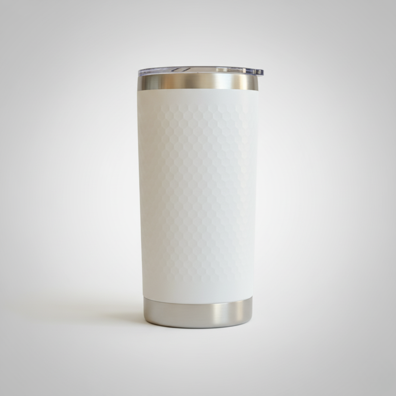 White insulated tumbler with stainless steel rim and base, shown against neutral background