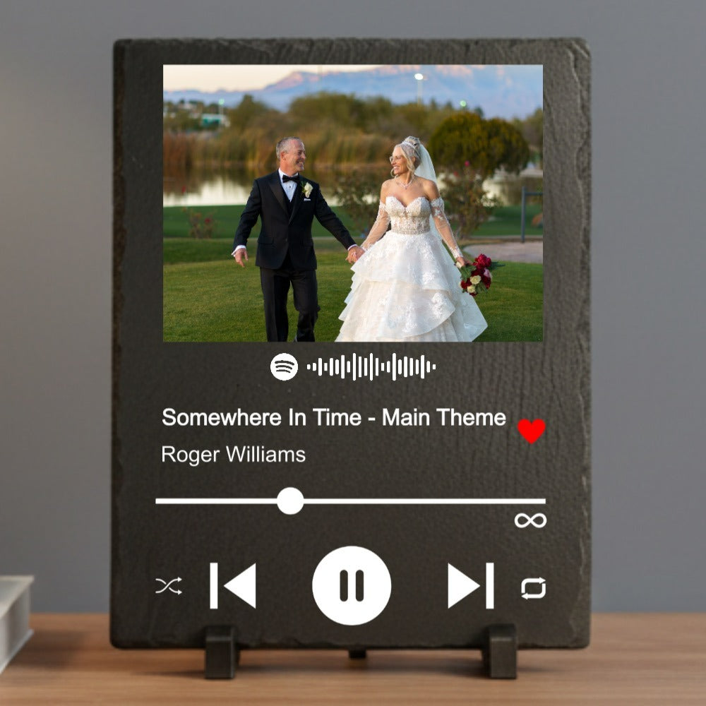 Personalized slate plaque displaying wedding photo with Spotify music player interface showing "Somewhere In Time - Main Theme" by Roger Williams and red heart icon