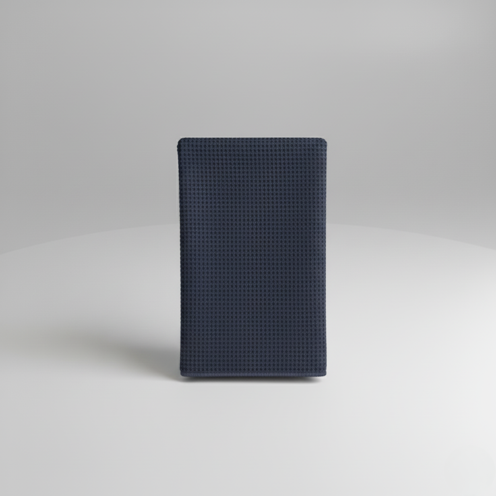 Navy blue textured wallet with woven diamond pattern, shown against neutral background