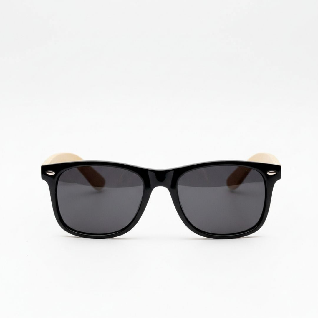 Black framed sunglasses with dark lenses and natural wood grain arms against white background