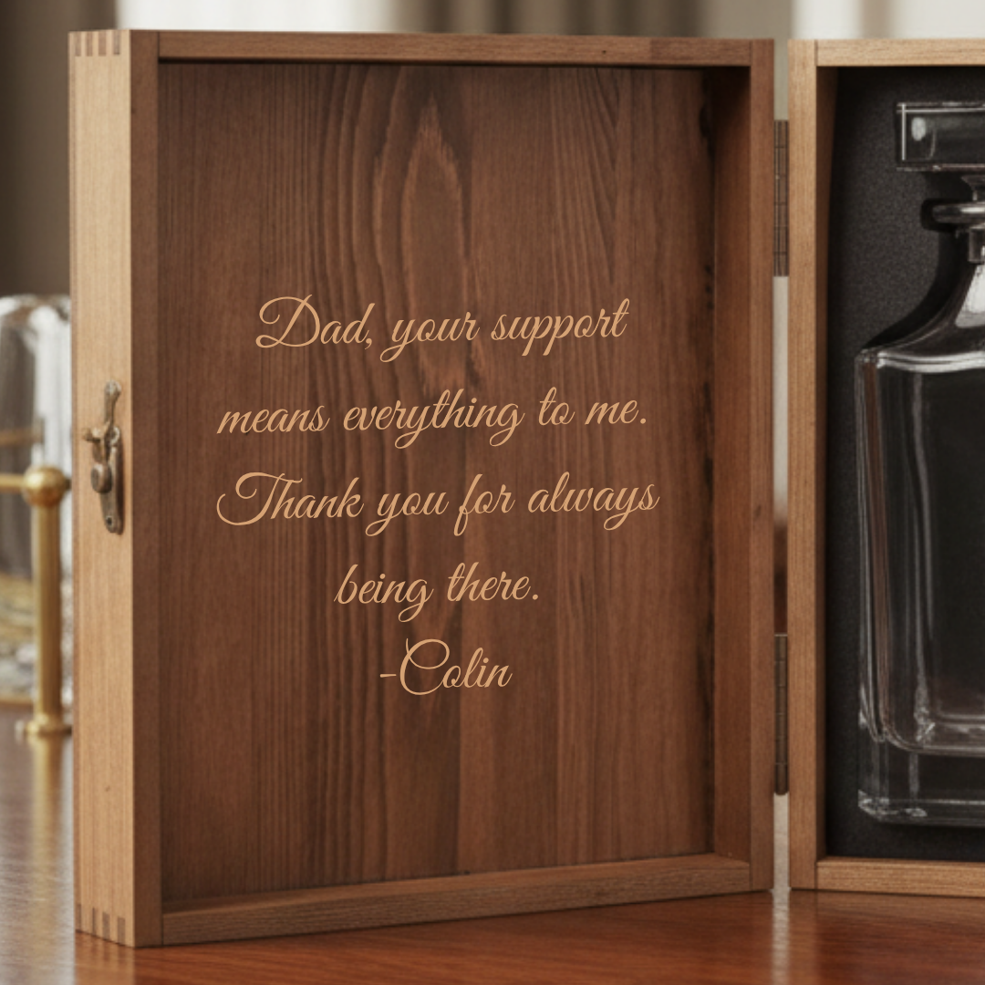 Dark wood decanter box with personalized engraving reading "Dad, your support means everything to me. Thank you for always being there. -Colin" in gold script lettering.