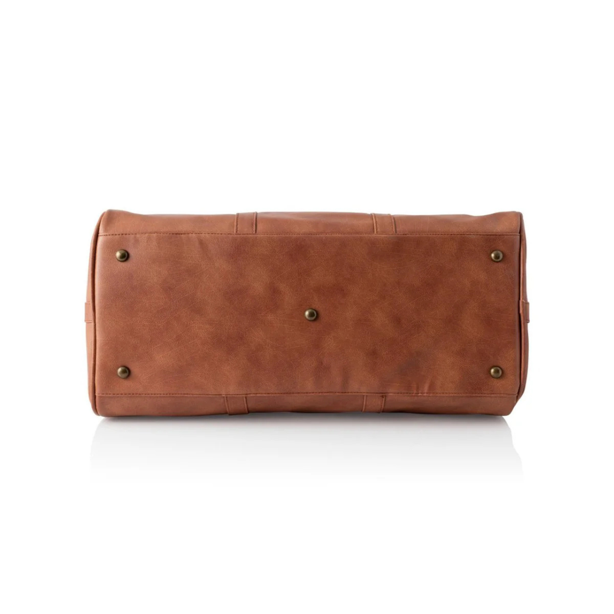 Bottom view of the cognac vegan leather duffle showing brass protective base studs and the reinforced stitching across the base panel