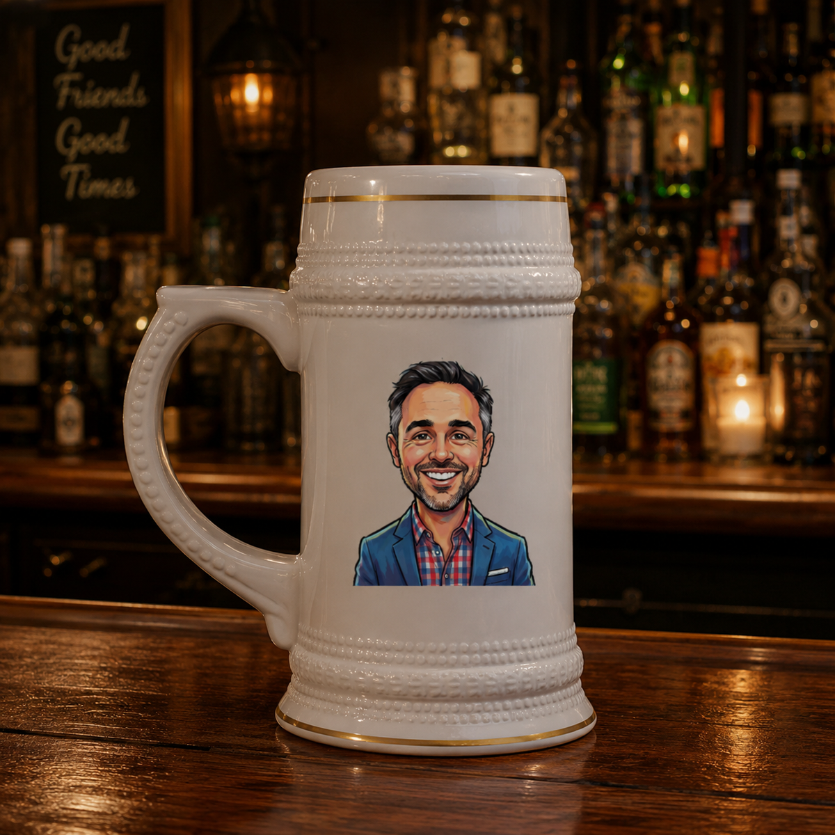 White ceramic beer stein with textured bands and gold trim, featuring a custom caricature illustration of a man in blue blazer and plaid shirt, displayed on a bar counter.