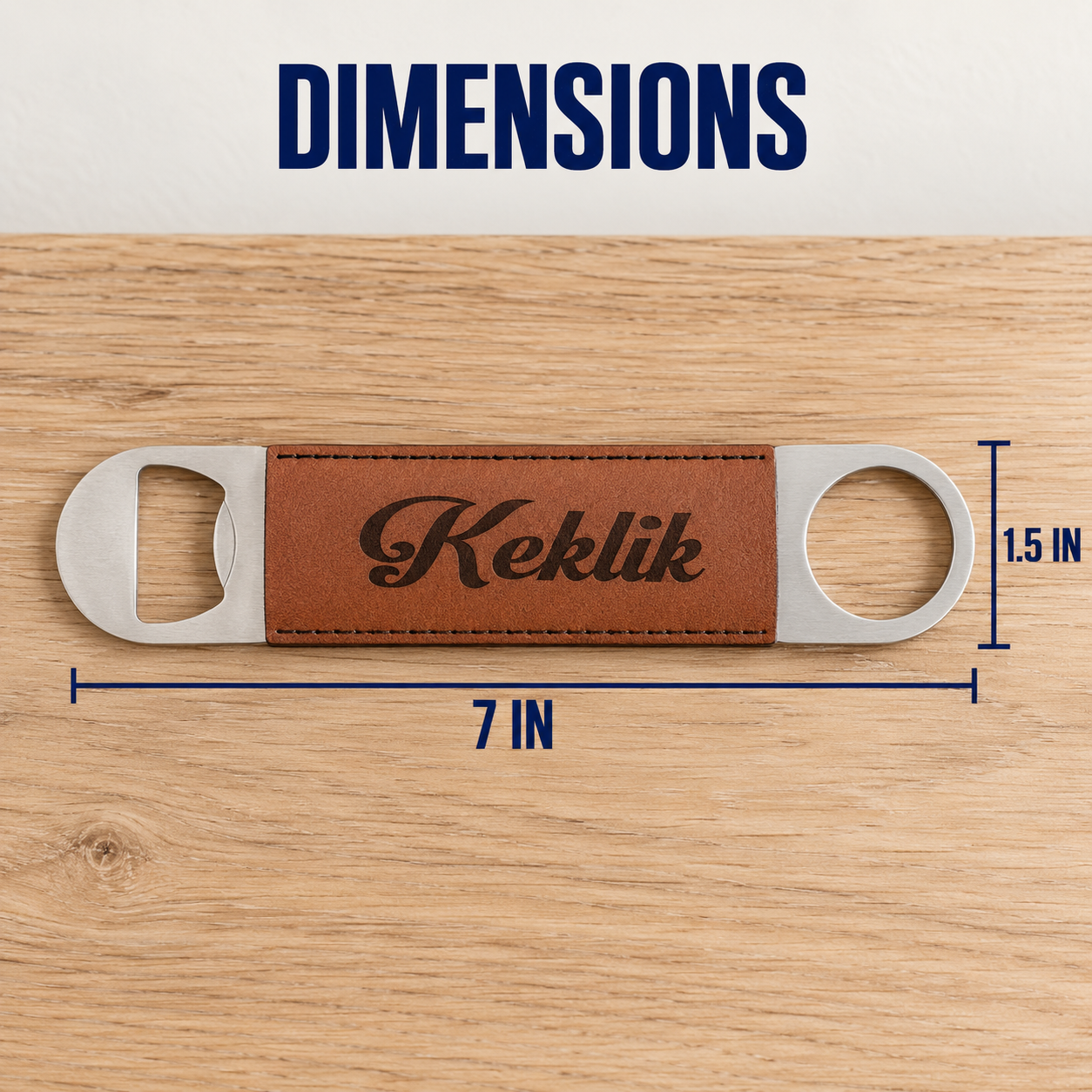 A bottle opener with a brown leather center strip engraved with the brand name 'Keklik' is shown on a wood surface, with dimension lines and text indicating 7 inches in length and 1.5 inches in height.