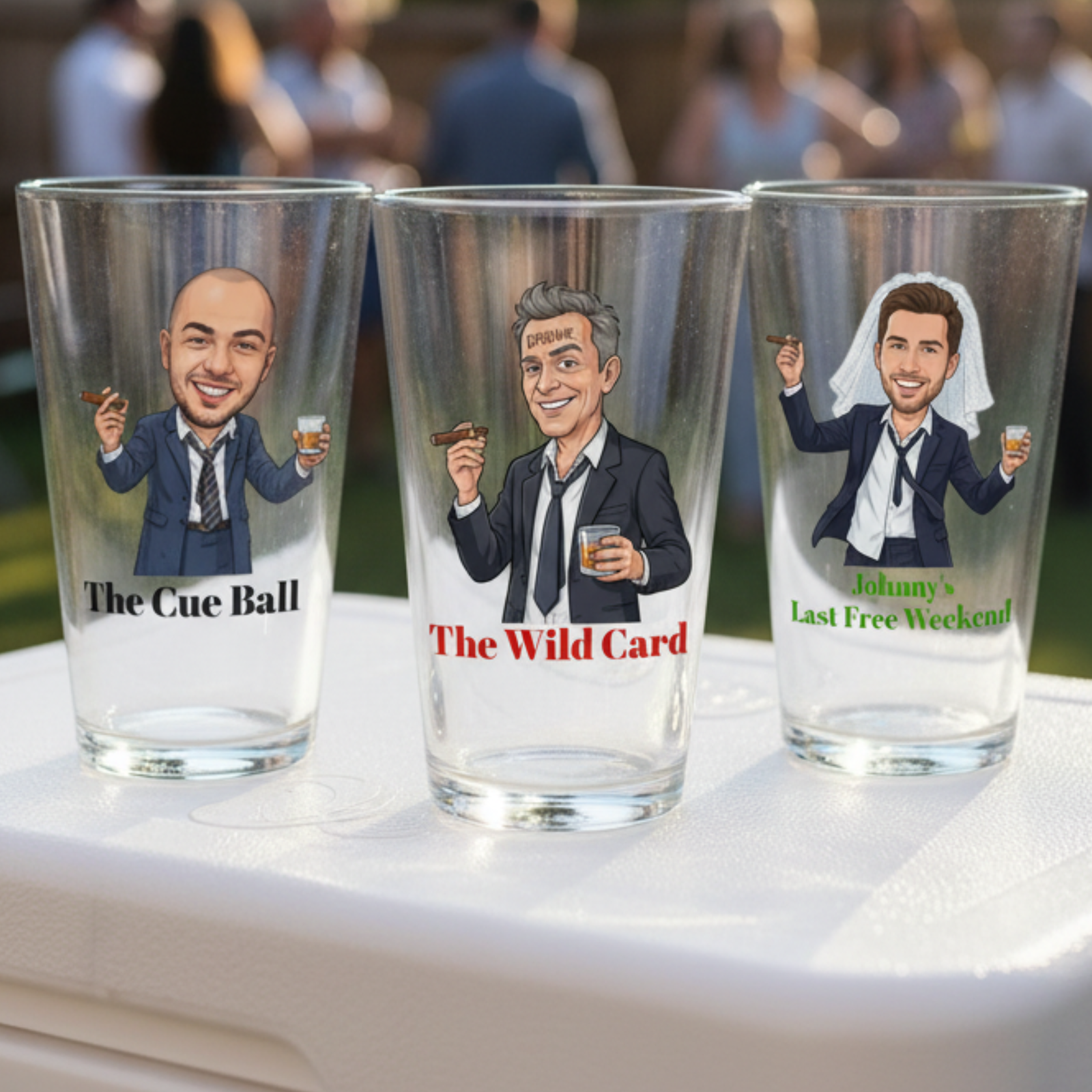 Three pint glasses with custom caricature designs featuring men in suits holding cigars and drinks, labeled "The Cue Ball," "The Wild Card," and "Johnny's Last Free Weekend
