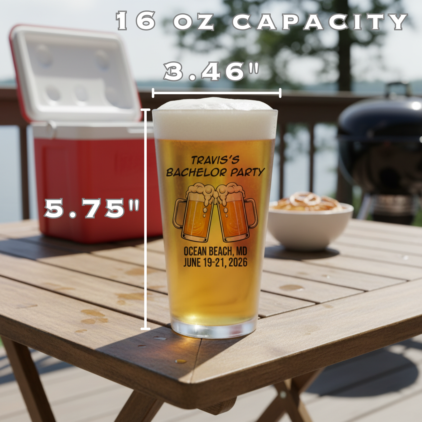 16oz pint glass printed with sample design "Travis's Bachelor Party" featuring clinking beer mugs, location, and dates, filled with beer on outdoor table