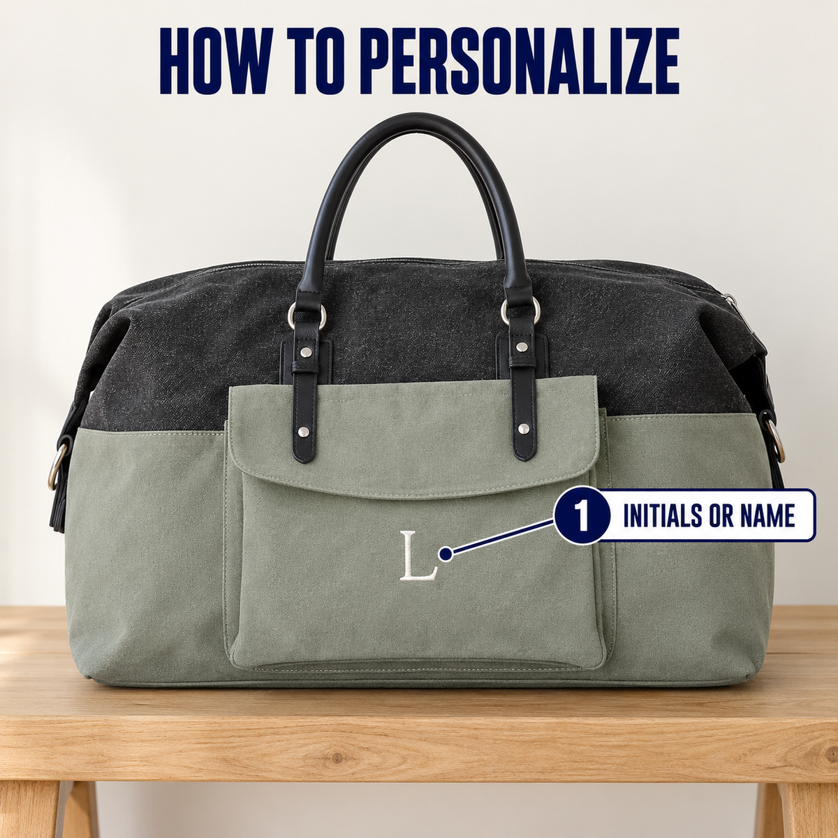 A two-tone duffel bag with a dark charcoal top half and an olive green bottom half, displayed on a wooden table. The image includes text overlays explaining personalization, with 'HOW TO PERSONALIZE' at the top and a callout indicating custom initials or name on the front pocket.