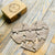 Personalized wooden puzzle heart set with custom romantic quotes and names, crafted from walnut-finished plywood, housed in a high-quality wooden box – perfect for anniversaries, Valentine’s Day, or weddings.