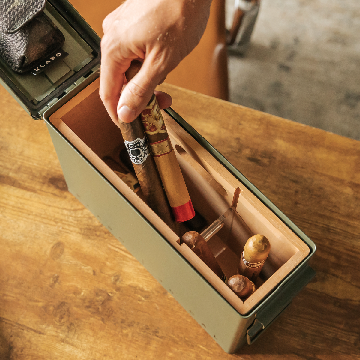 30 Cal ammo can cigar humidor with Spanish cedar tray and magnetic accessory holder – rugged military-inspired design.