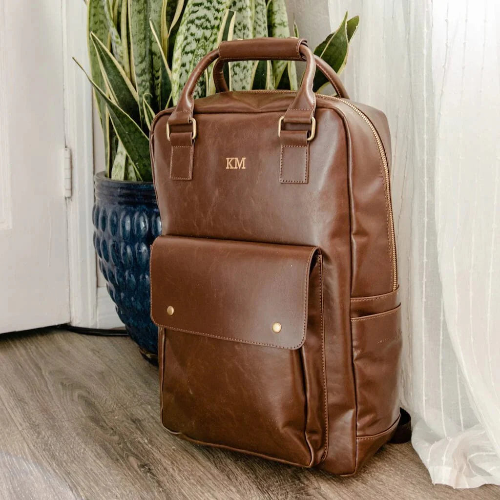 Brown vegan leather laptop backpack with custom name engraving and front flap pocket