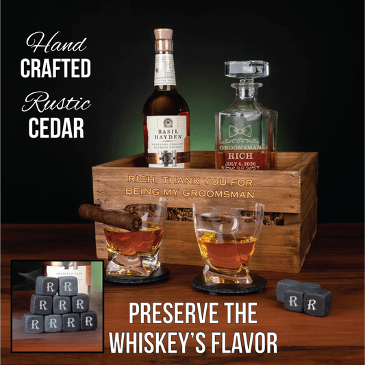 Hand-crafted rustic cedar crate with engraved sample text "Rich, thank you for being my groomsman" and date, displaying bourbon bottle, decanter, glasses, and engraved whiskey stones.