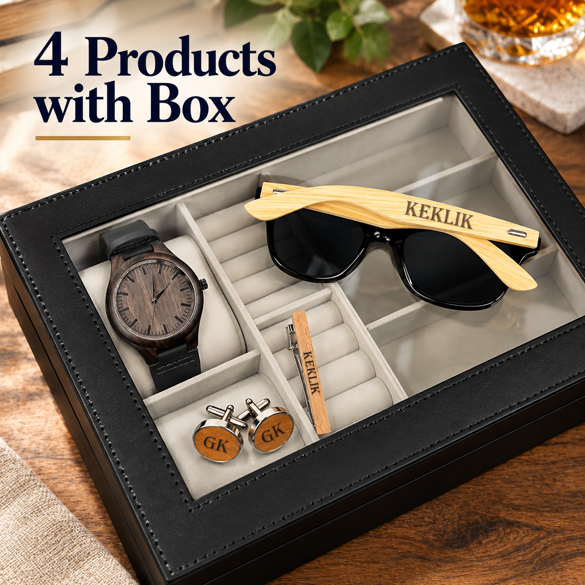 A black gift box with a clear top window displaying a watch, sunglasses, cufflinks, and a pin, arranged on a wooden surface. Large text in the upper left reads '4 Products with Box'.