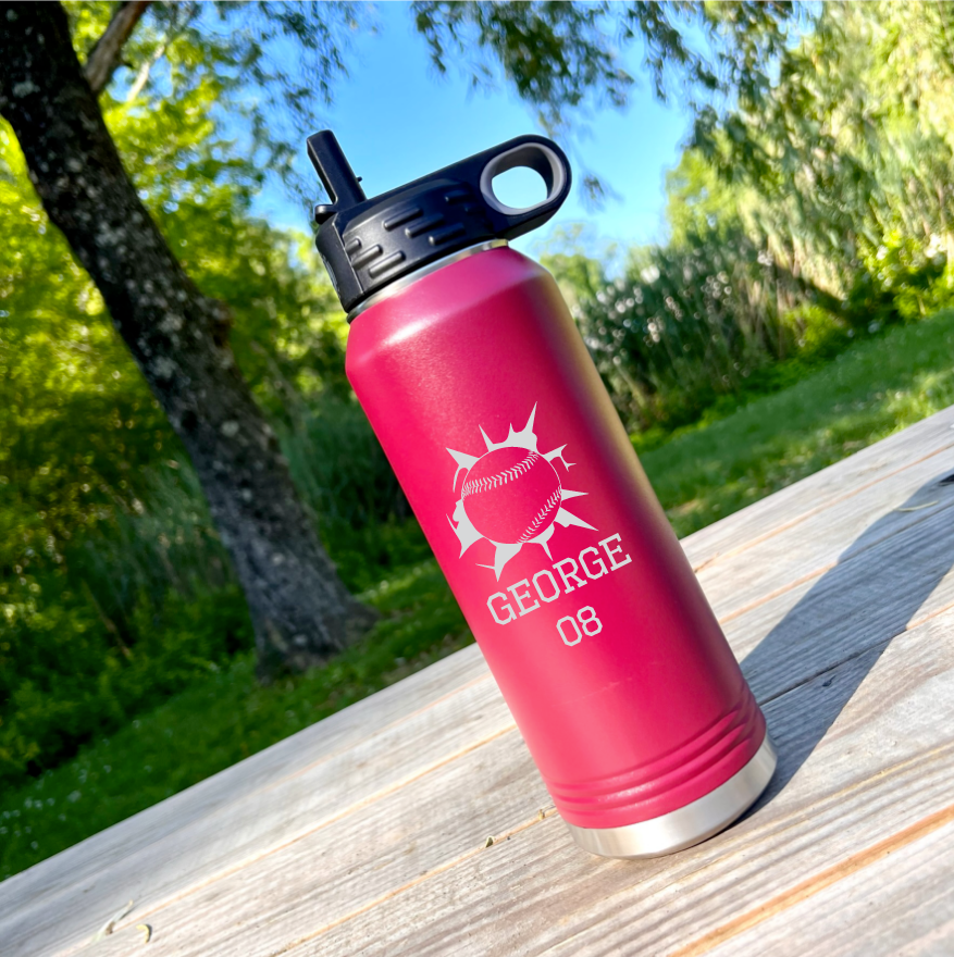 Bright pink insulated tumbler with black flip-top lid, engraved with sample baseball design, name "GEORGE" and number "08