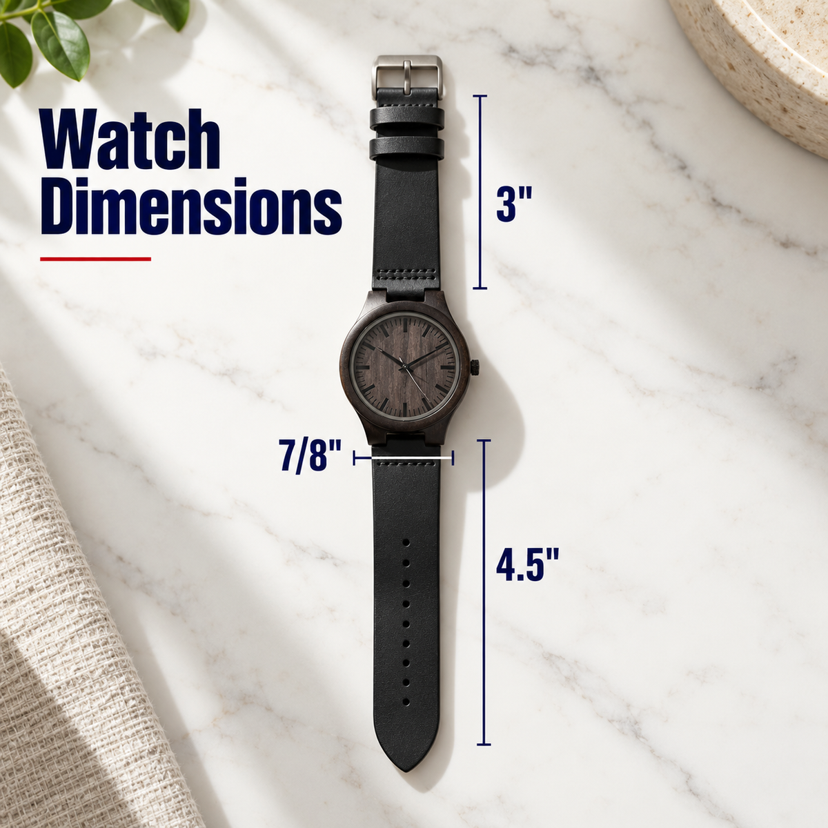 A wristwatch with a dark round dial and black strap is shown on a white marble surface with overlaid dimension labels reading 3 inches, 7/8 inches, and 4.5 inches, plus the text 'Watch Dimensions'.