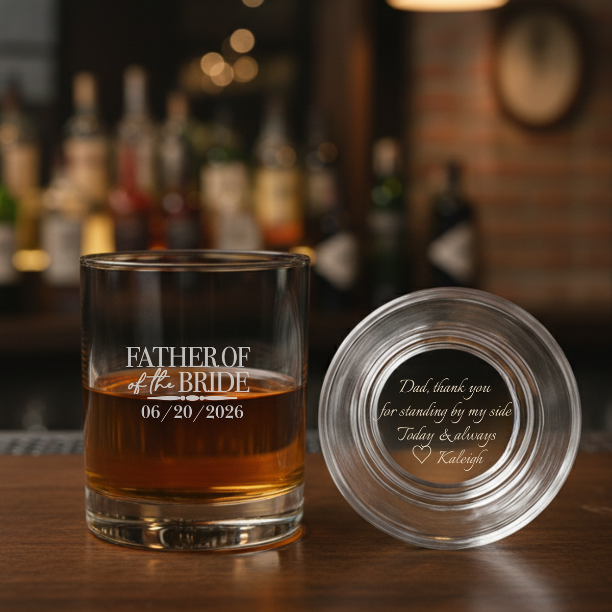 Whiskey glass engraved with "Father of the Bride" and wedding date 06/20/2026, shown with matching coaster featuring sample personalized message on bottom