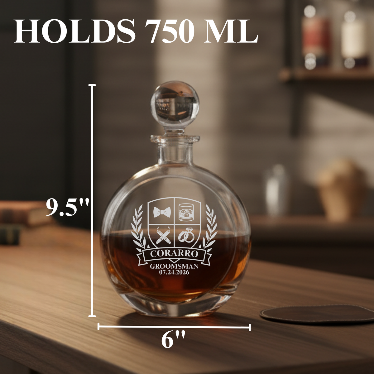 Personalized whiskey decanter engraved with sample text "CORARRO GROOMSMAN 07.24.2026" and decorative crest, filled with amber liquid, shown with dimensions 9.5" height and 6" width.