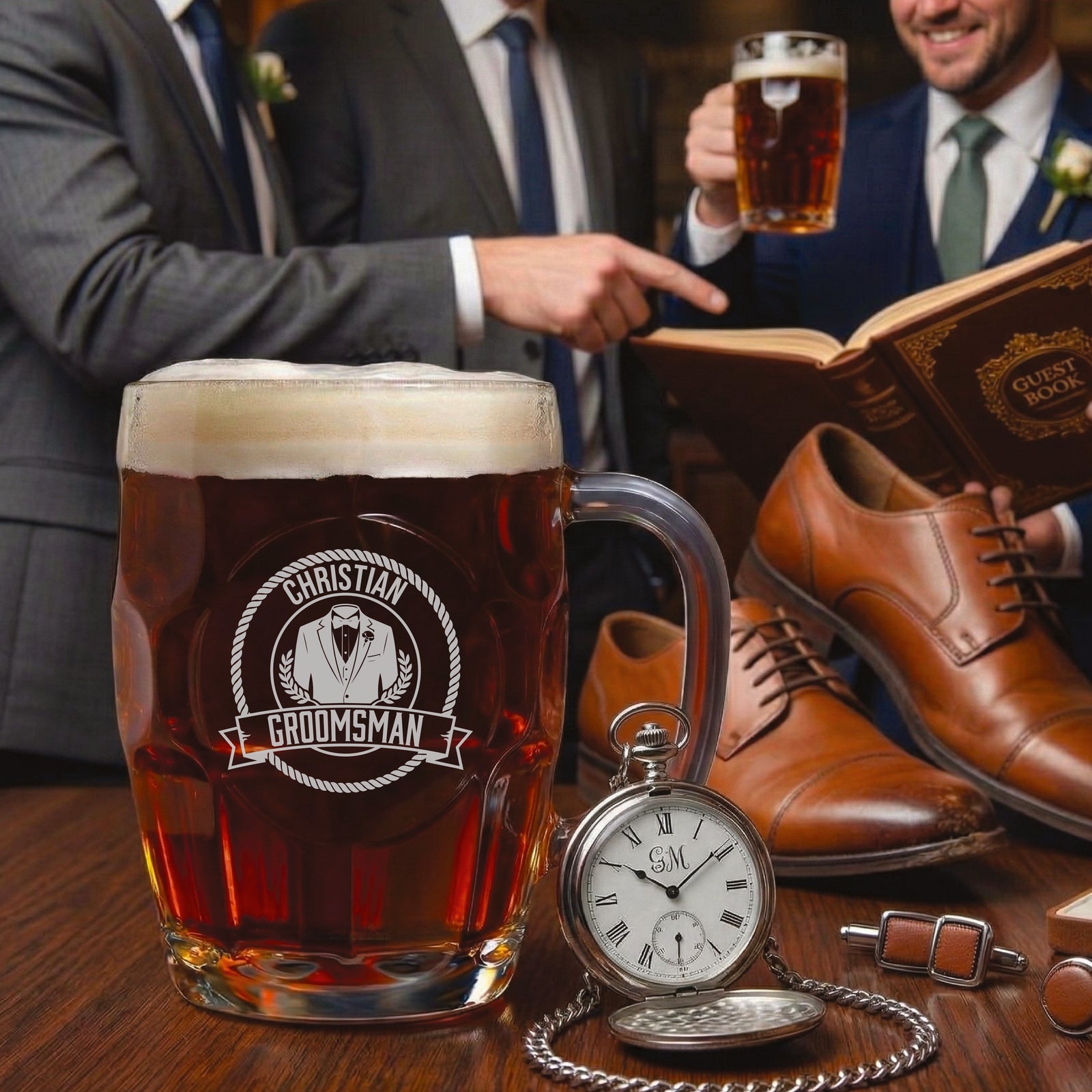 Personalized beer mug engraved with sample name "CHRISTIAN" and "GROOMSMAN" text, displayed with pocket watch, cufflinks, shoes, and guest book in lifestyle setting.