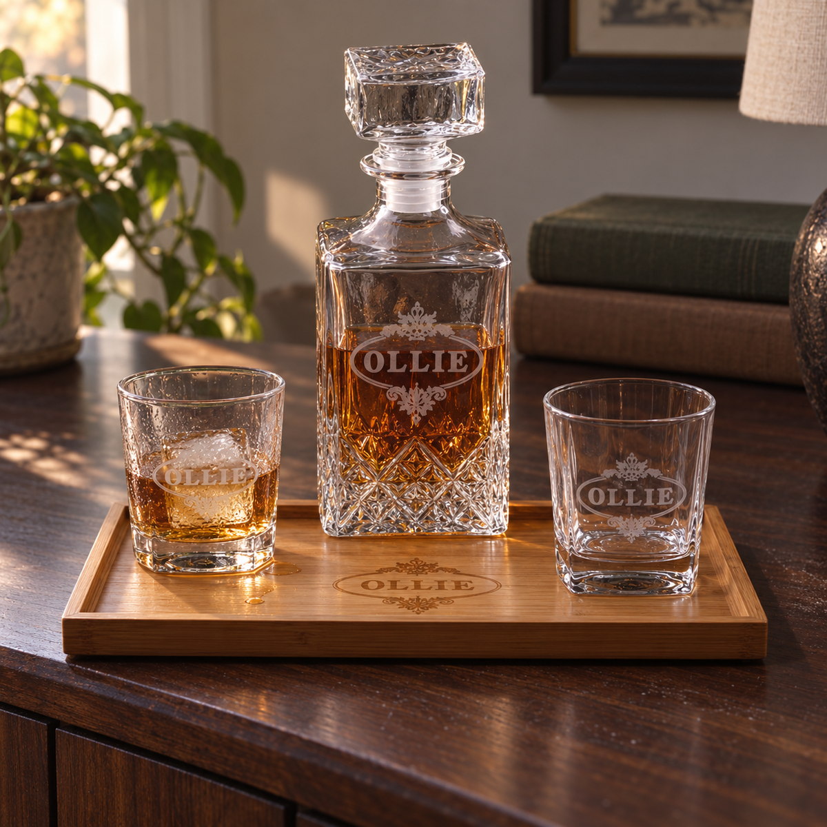 Serve It Up custom decanter set: a square glass decanter, two whiskey glasses and a bamboo tray, each engraved with the name Ollie