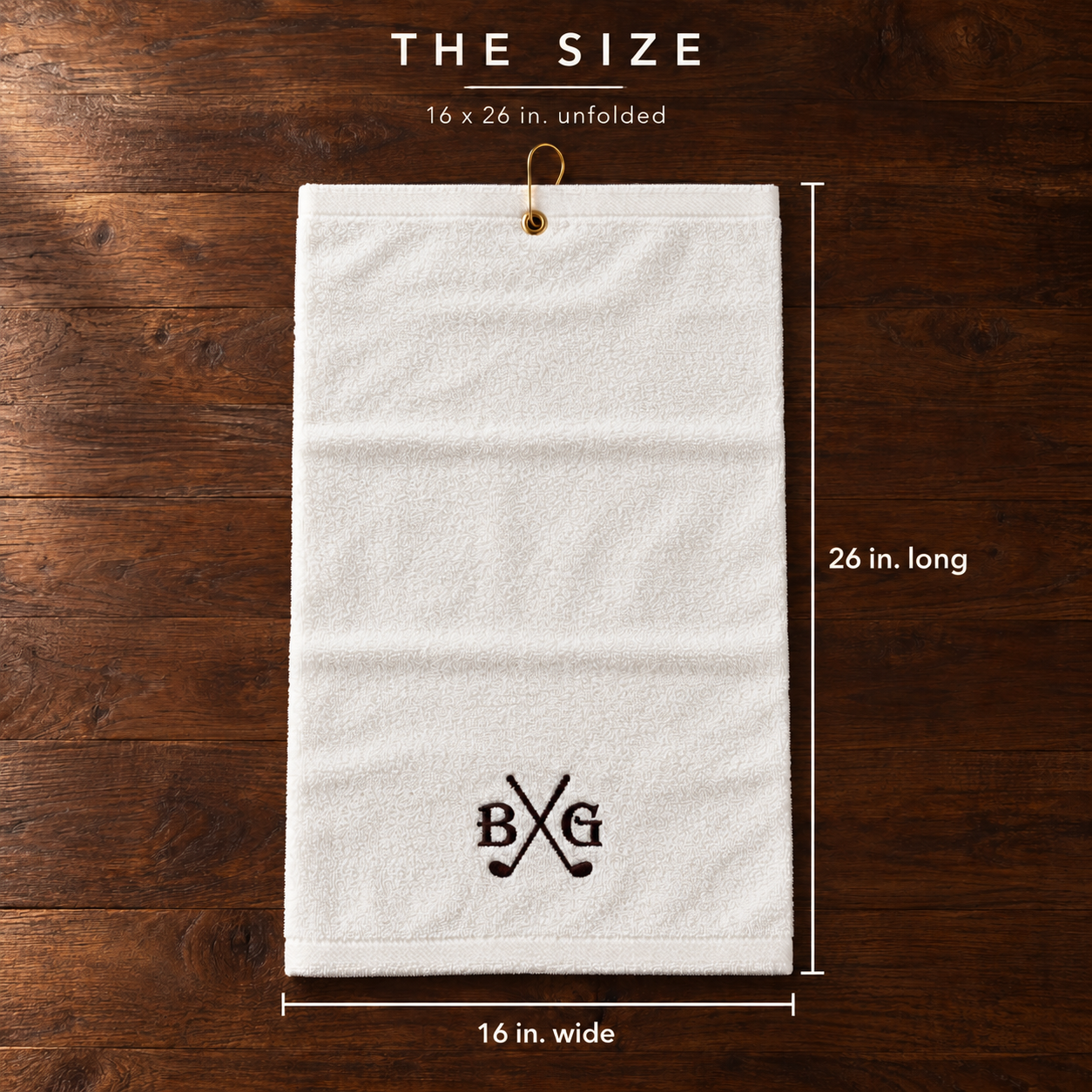 Size of the custom golf towel: 16 by 26 inches unfolded, white cotton with embroidered initials BG around crossed golf clubs