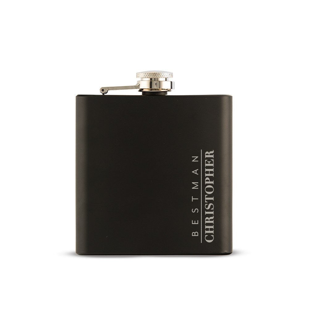 Matte black groomsmen flask on a plain white background, engraved BESTMAN in spaced capitals beside the name CHRISTOPHER running down the right side of the front