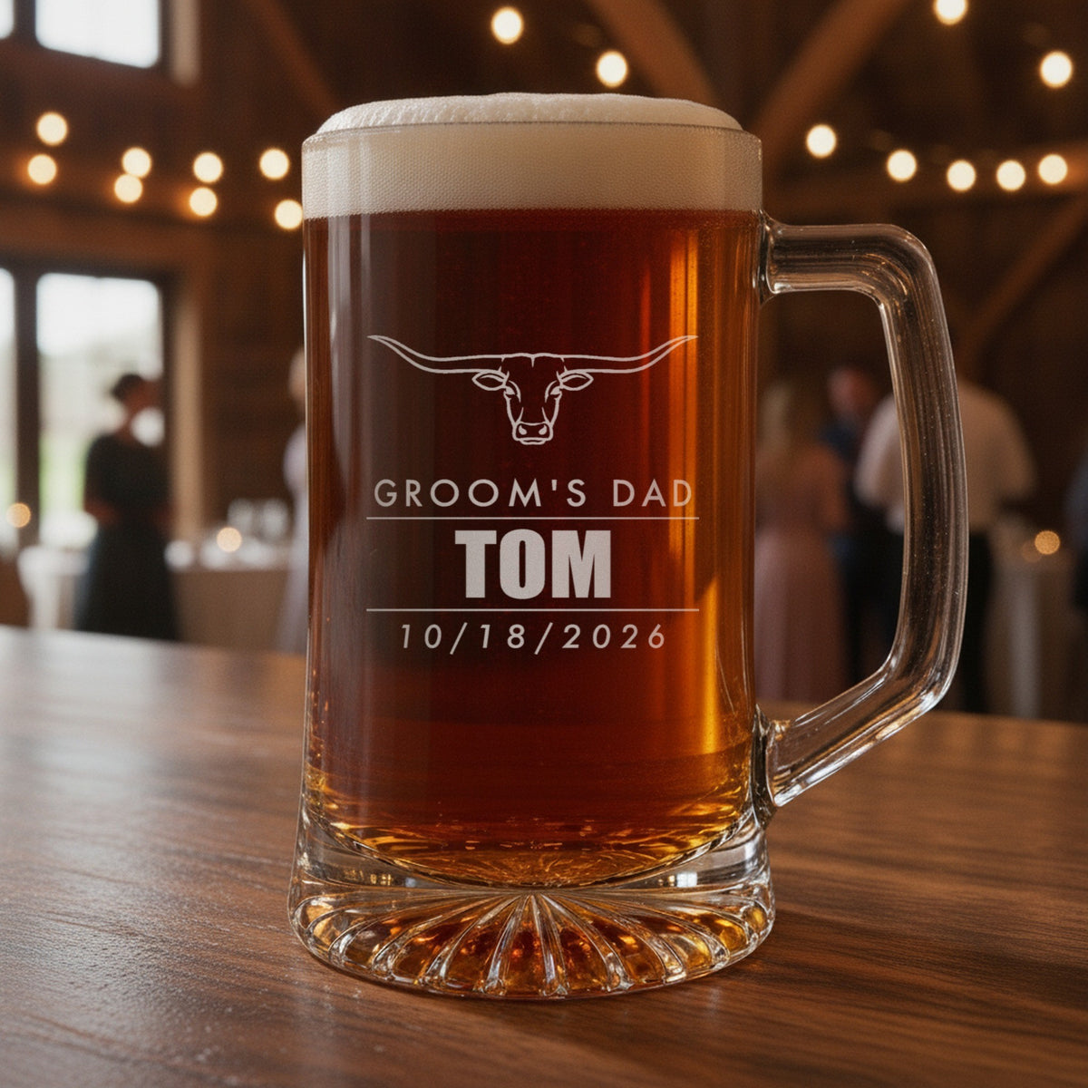 Personalized father of the groom beer stein on a barn reception bar, engraved with a longhorn, Groom's Dad, Tom and 10/18/2026