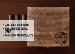 Walnut cigar box with laser-engraved sample design reading 