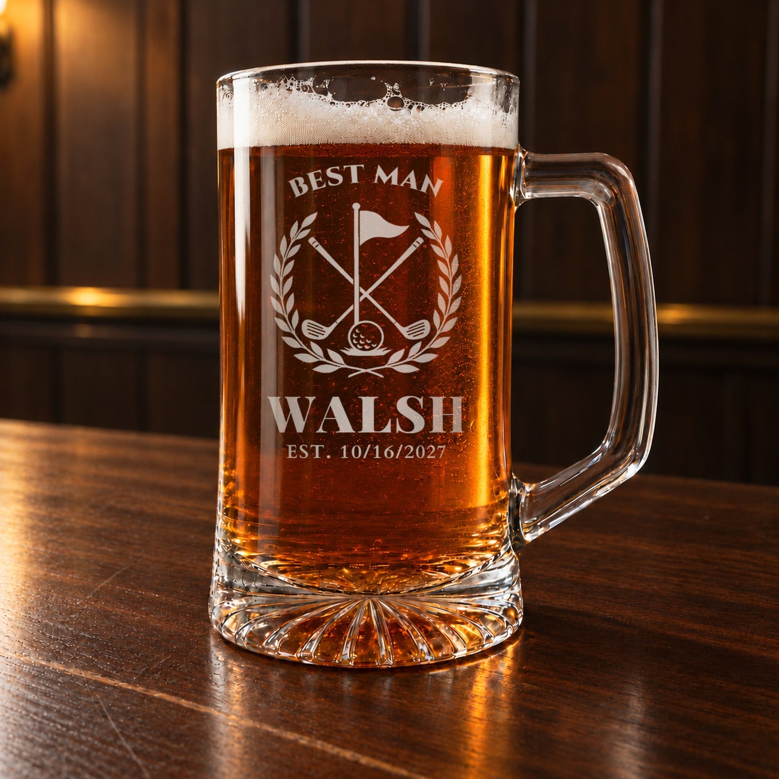 Personalized golf groomsmen beer stein on a walnut bar, engraved with a golf flag, crossed clubs and laurel: Best Man, Walsh, Est. 10/16/2027