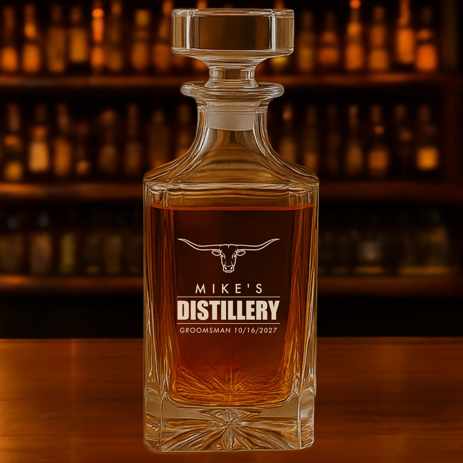 Personalized whiskey decanter for a groomsman engraved like a distillery label: a longhorn over Mike's Distillery, Groomsman 10/16/2027