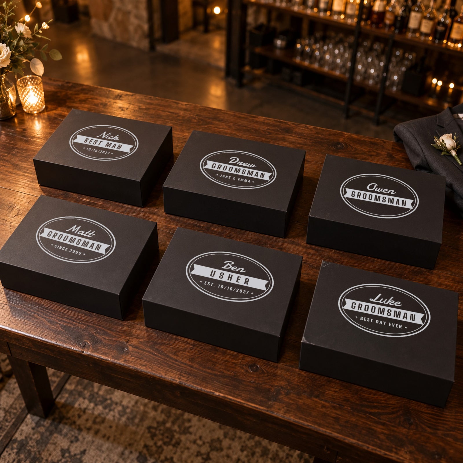 Six engraved beer gift boxes for a wedding party, each lid with a different groomsman name, role and short bottom line like Since 2009