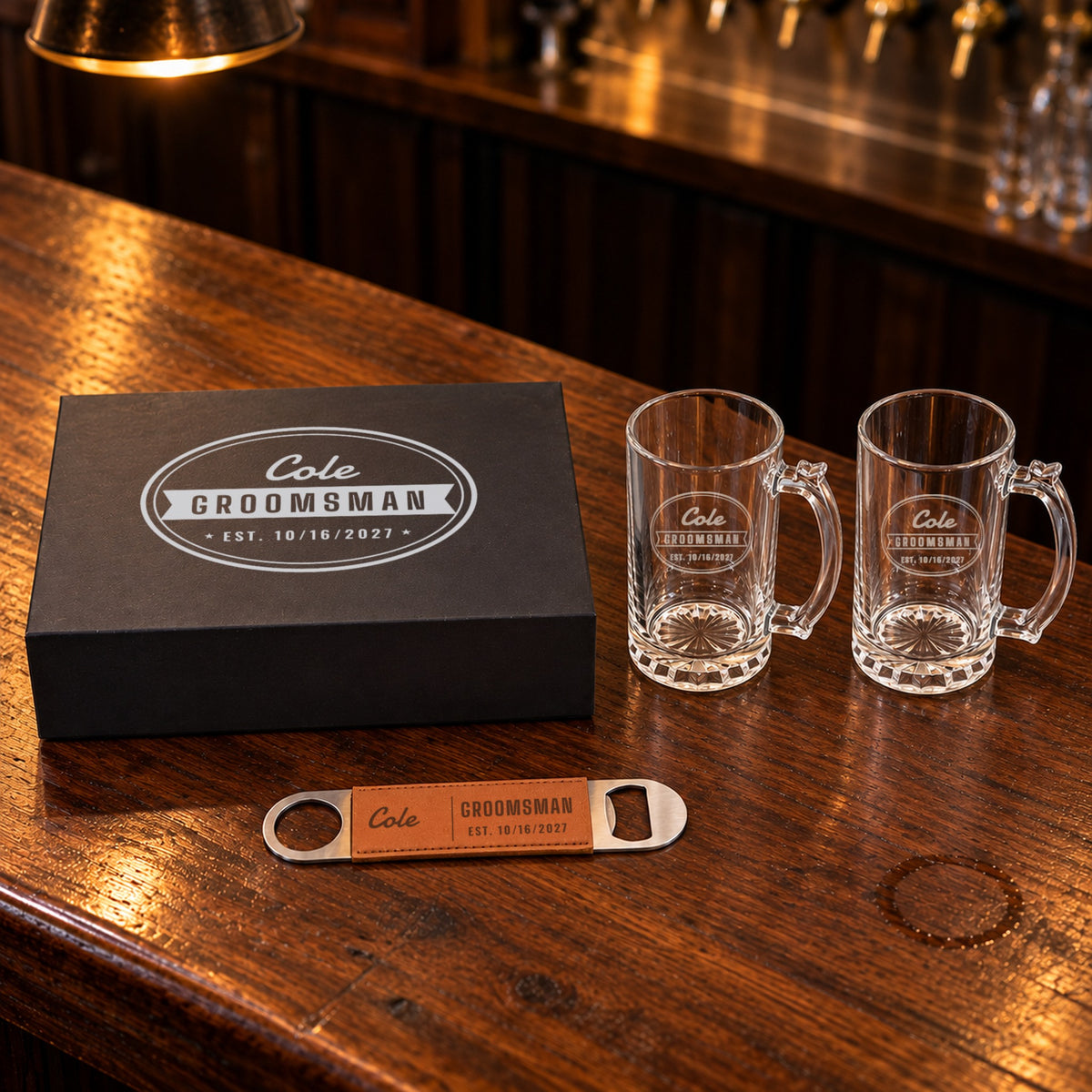 Groomsmen beer mug gift set: black box lid engraved Cole, Groomsman, Est. 10/16/2027, with two etched beer mugs and a bottle opener