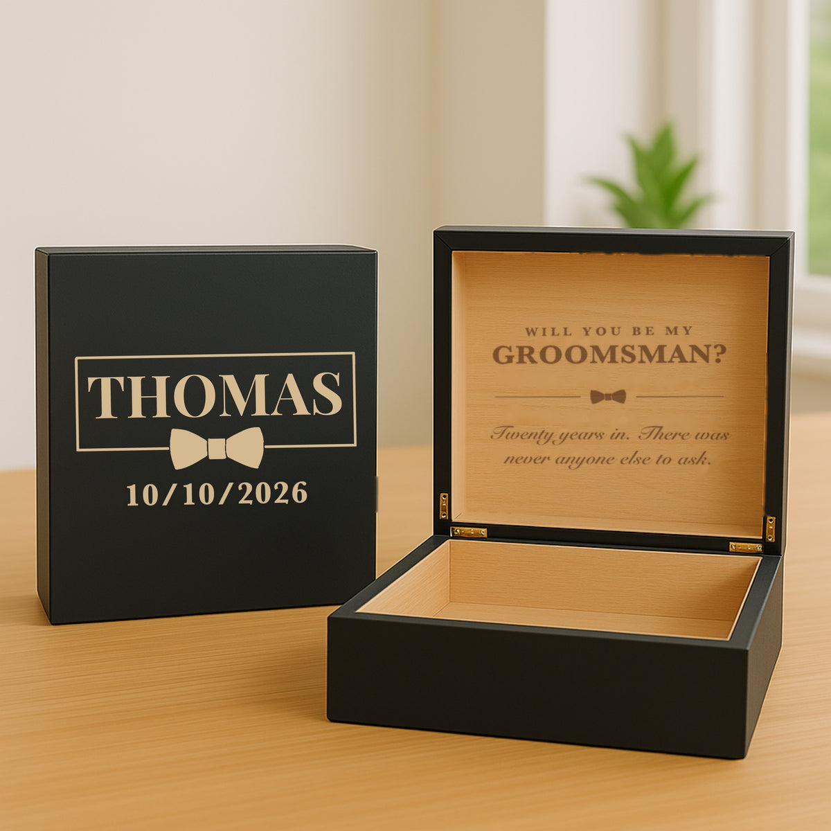 Black personalized keepsake box for a groomsmen proposal, name and wedding date on the lid and the engraved question showing inside.