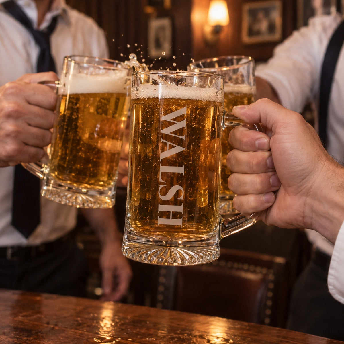 Groomsmen in white shirts and loosened ties toasting with personalized steins in a pub, the front stein engraved with the name WALSH