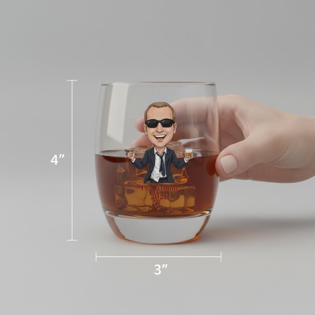Whiskey glass held in hand, filled with amber liquid, featuring custom illustration of man in sunglasses and suit with sample text "The Groom 2026" below, dimensions 4" height by 3" width marked on sides
