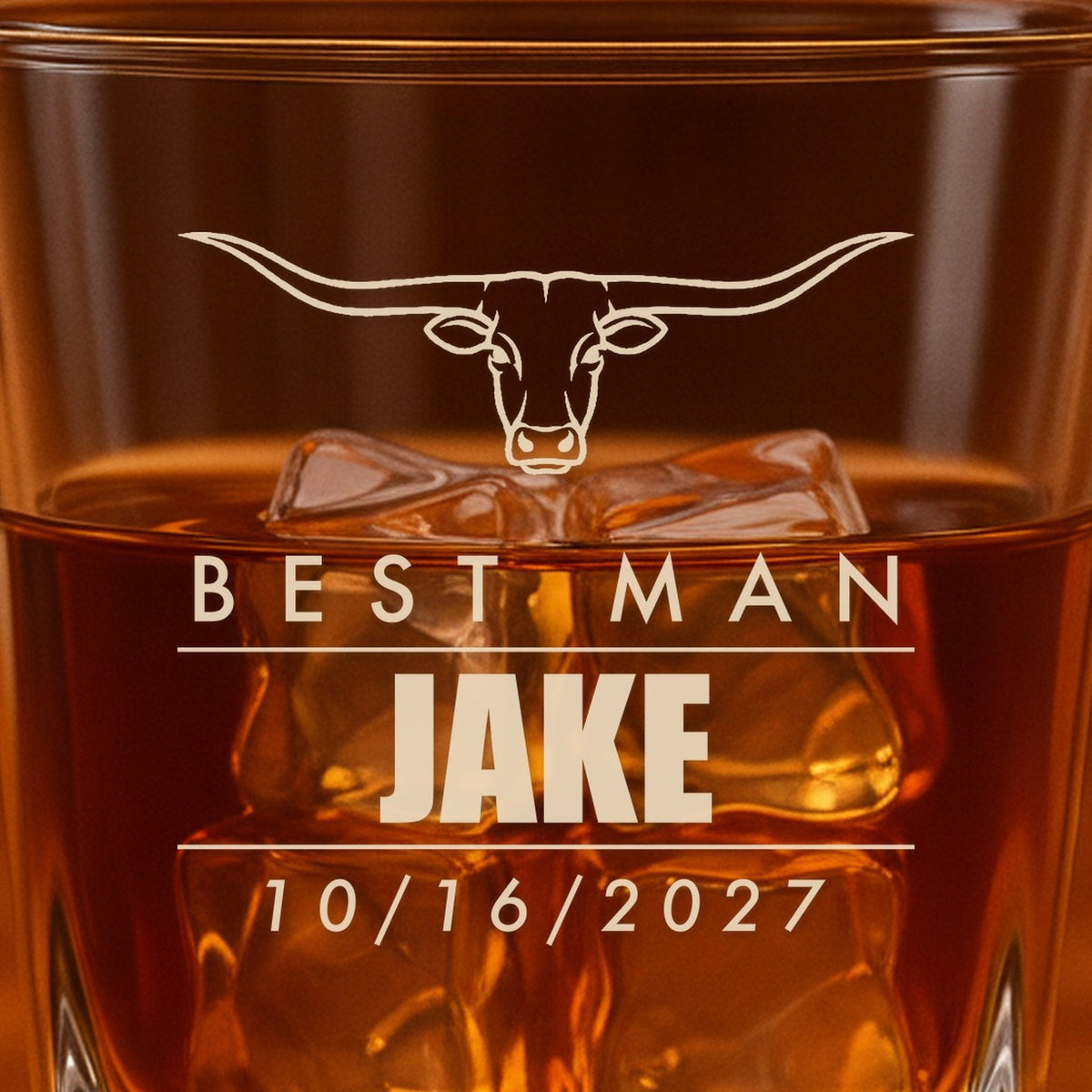 Close-up of the frosted laser engraving on the groomsmen whiskey glass: a longhorn steer, Best Man, Jake in bold and the date 10/16/2027