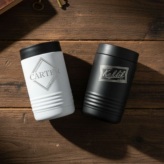Two groomsmen tumblers, one white and one black, with personalization on a wooden surface.